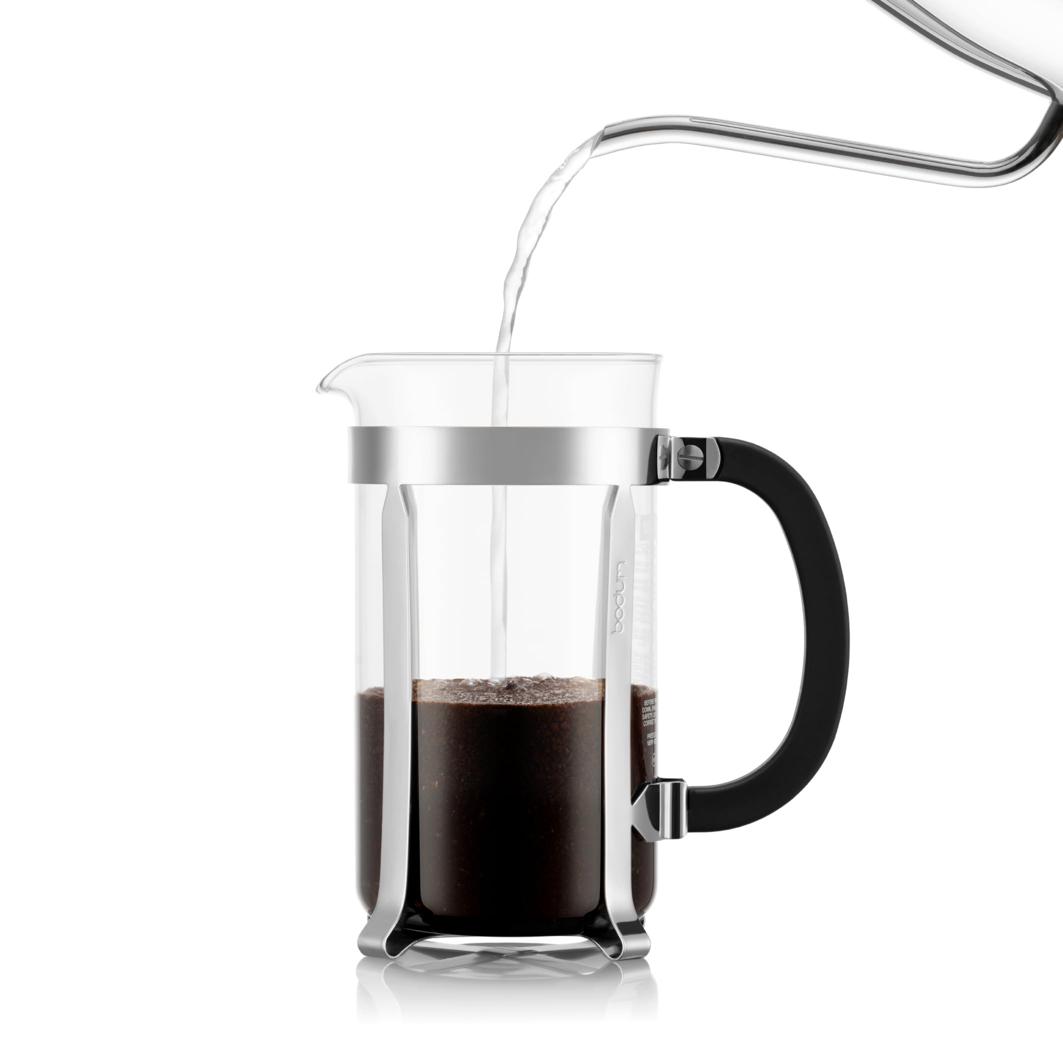 Bodum Chambord pouring coffee into a mug demonstrating easy serving and heat resistance