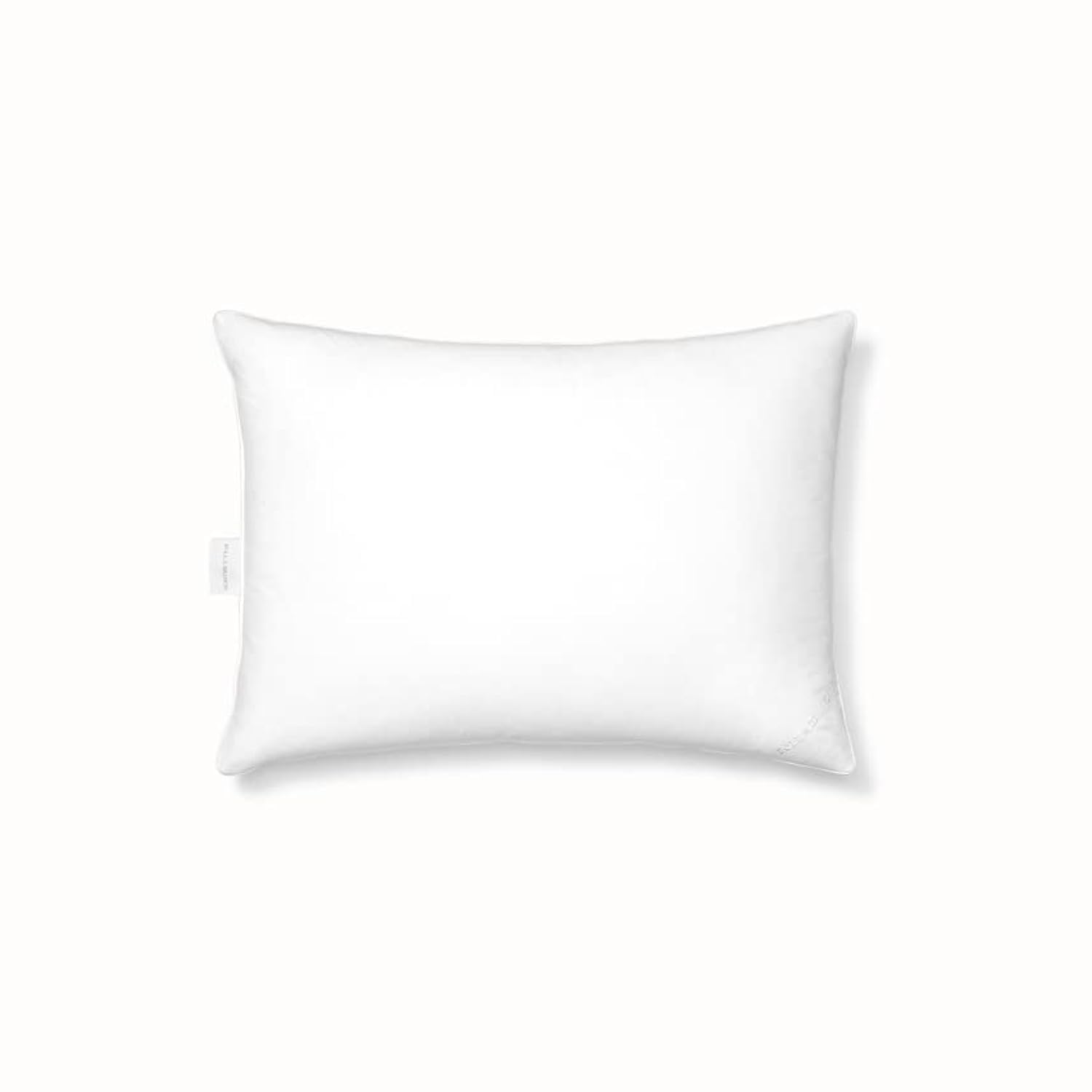 BOLL & BRANCH pillow on styled bed highlighting cozy look and natural materials