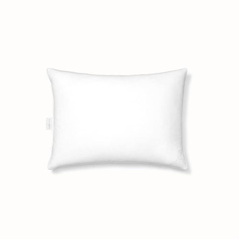 BOLL & BRANCH pillow on styled bed highlighting cozy look and natural materials
