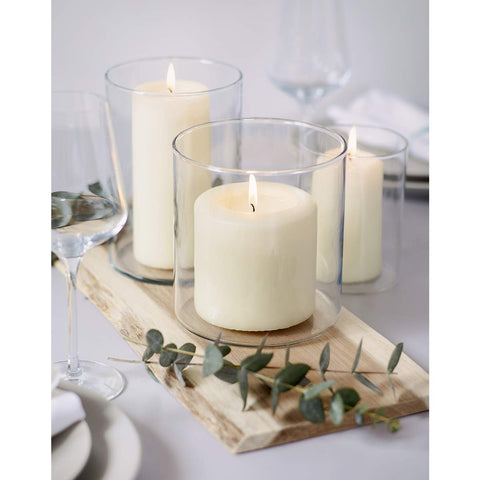 Bolsius pillars in a table centerpiece with florals benefit: enhances event decor