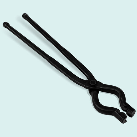 Bonbo tongs holding a knife billet on anvil for precise bladesmith control
