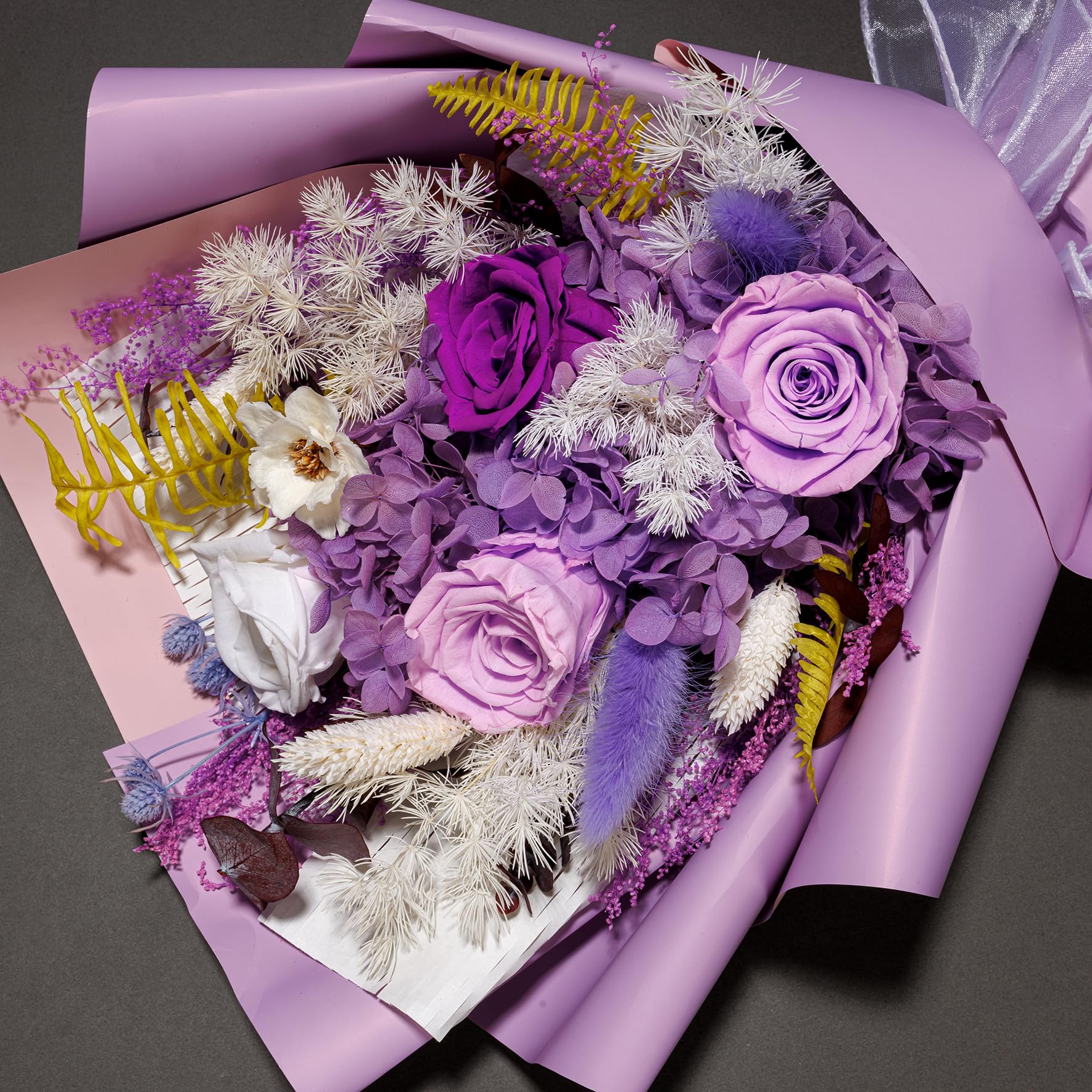 Bonsion bouquet in vase styled in living room adding lasting color