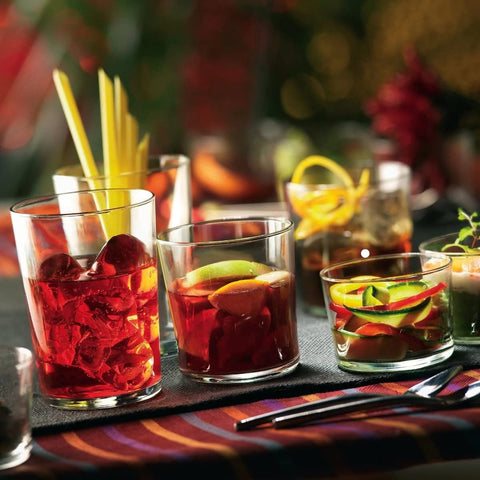 Bormioli Rocco tumbler with cocktail in hand demonstrating versatile serving benefit
