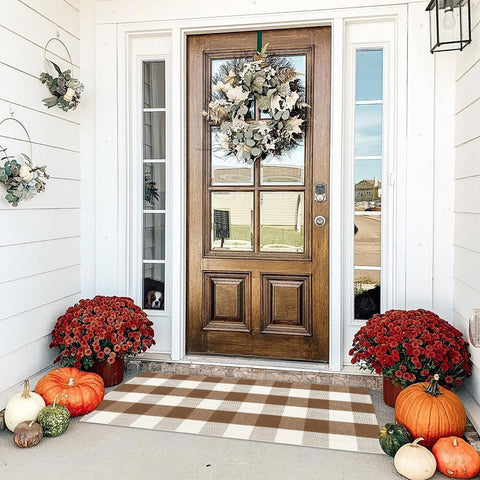 Bottalive front view brown white checkered rug adds welcoming curb appeal