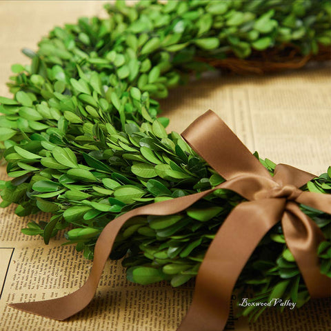 BOXWOOD VALLEY wreath above mantel creating elegant seasonal atmosphere