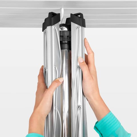 Brabantia ground spike installed in lawn with cap for secure anchoring