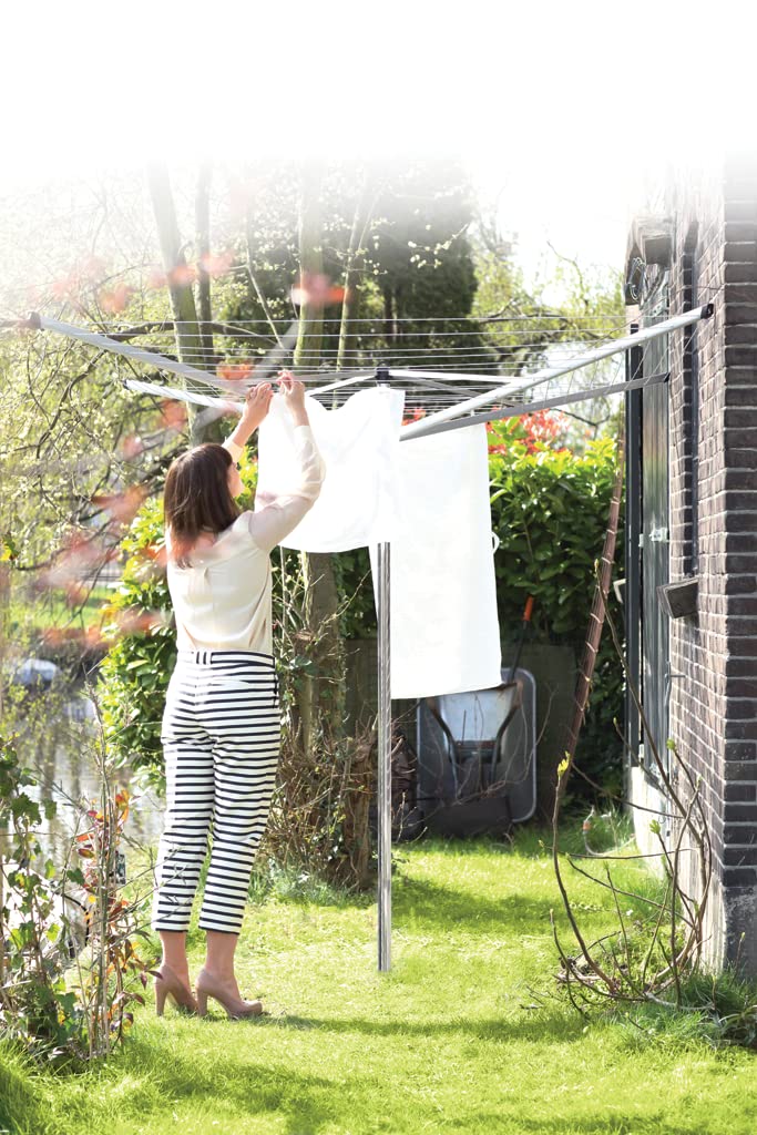 Brabantia Topspinner with wet laundry hung showing even airflow and faster drying benefit