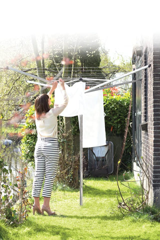 Brabantia Topspinner with wet laundry hung showing even airflow and faster drying benefit