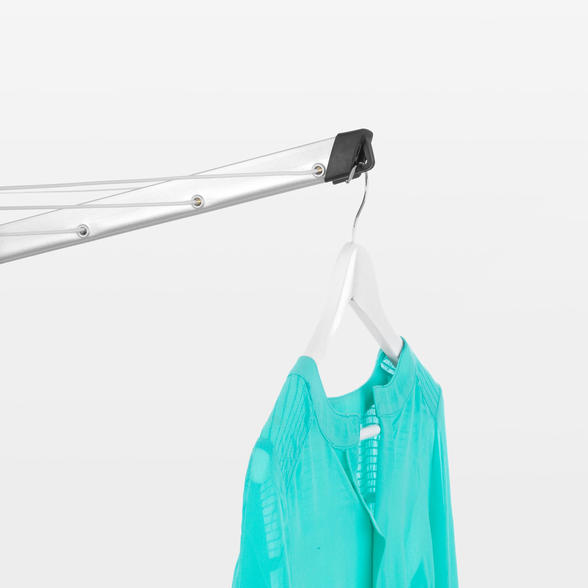 Brabantia topspinner next to person for scale showing roomy drying capacity