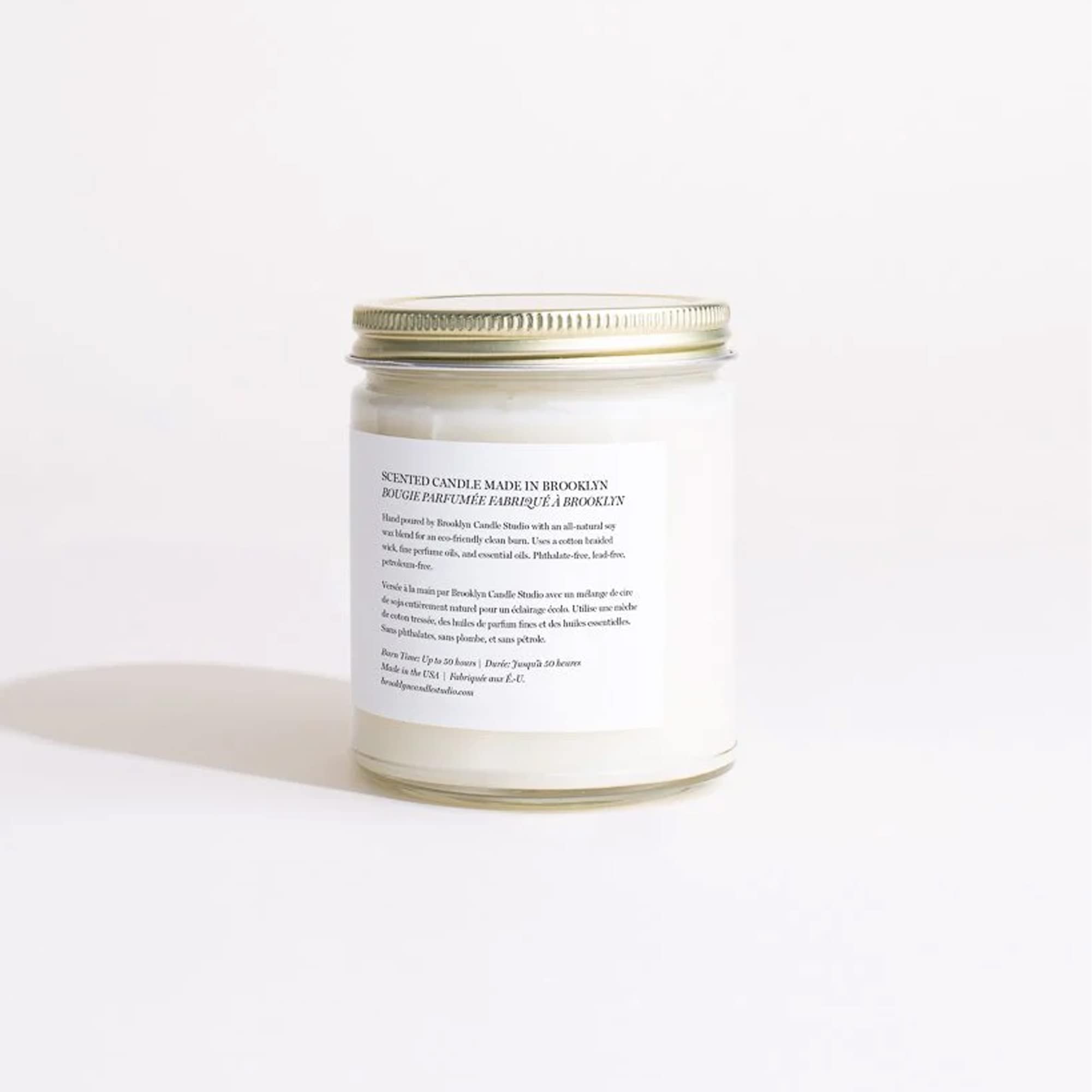 Brooklyn Candle Studio brushed-gold lid detail emphasizes refined finish benefit: preserves scent