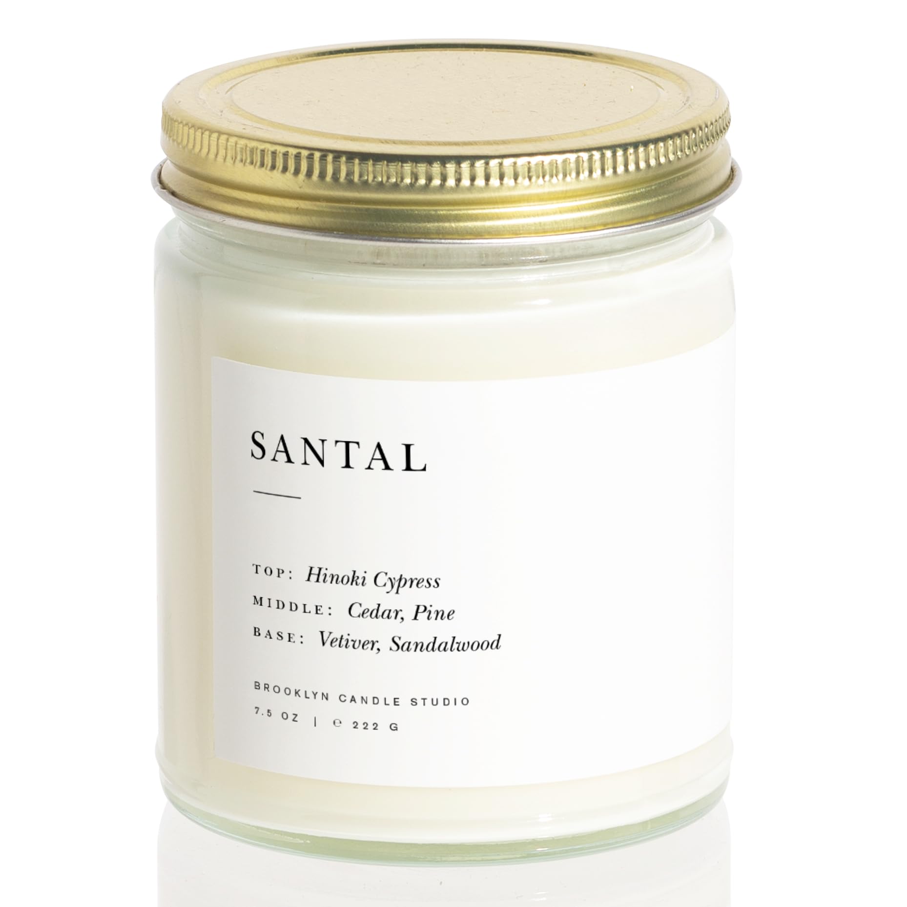 Brooklyn Candle Studio candle next to coffee mug shows scale benefit: compact for small spaces