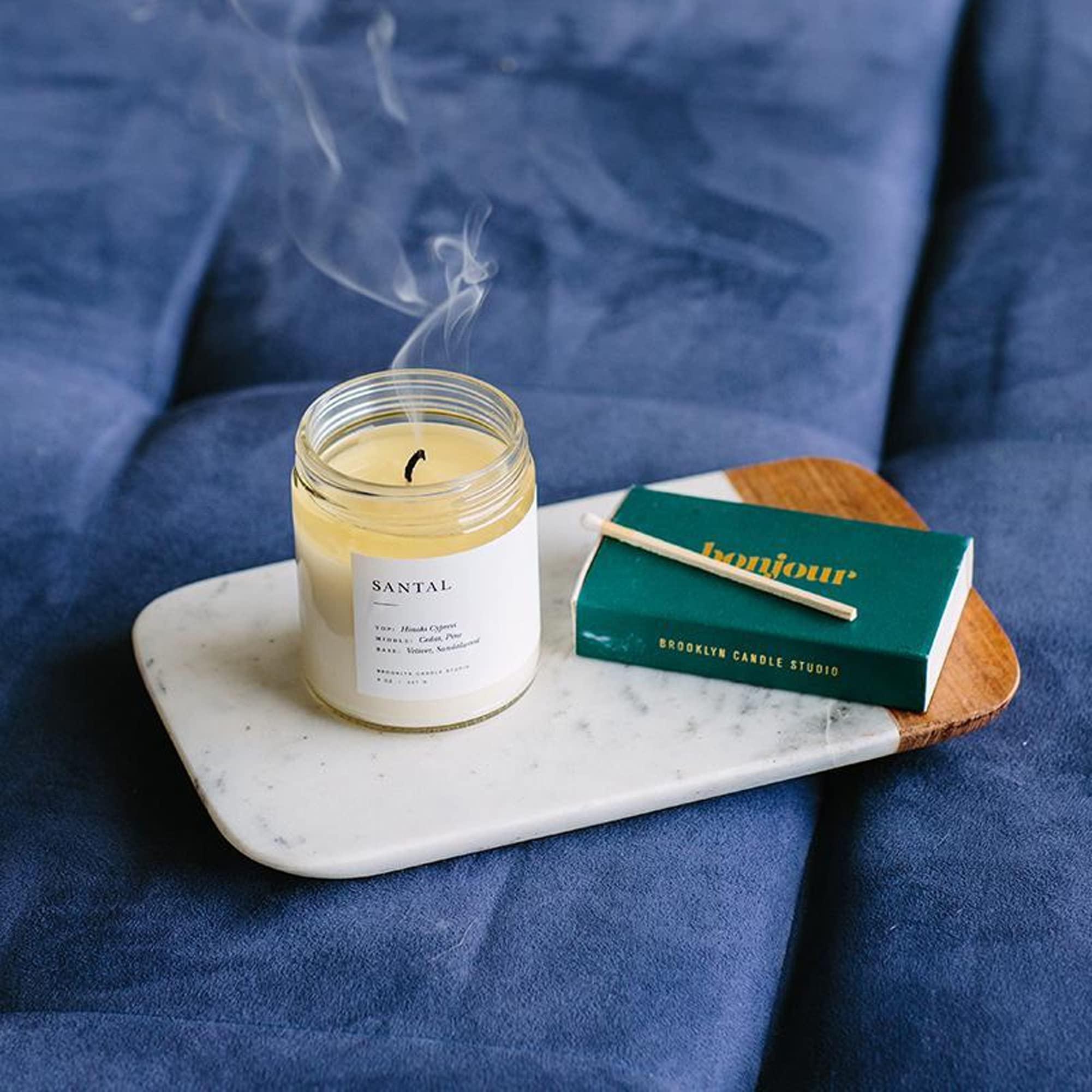 Brooklyn Candle Studio candle styled on bedside table creates calm atmosphere benefit: gift-ready aesthetic