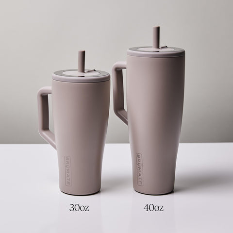 BrüMate Era fitting in a car cup holder for hands-free travel convenience