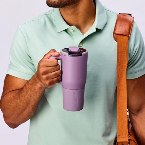 BrüMate Müv in commuter scene in Blue Agave, leakproof travel convenience