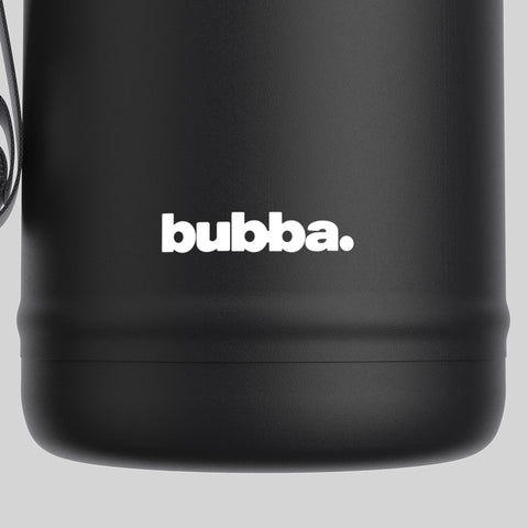 Bubba next to a water glass for scale, large 64 oz capacity advantage
