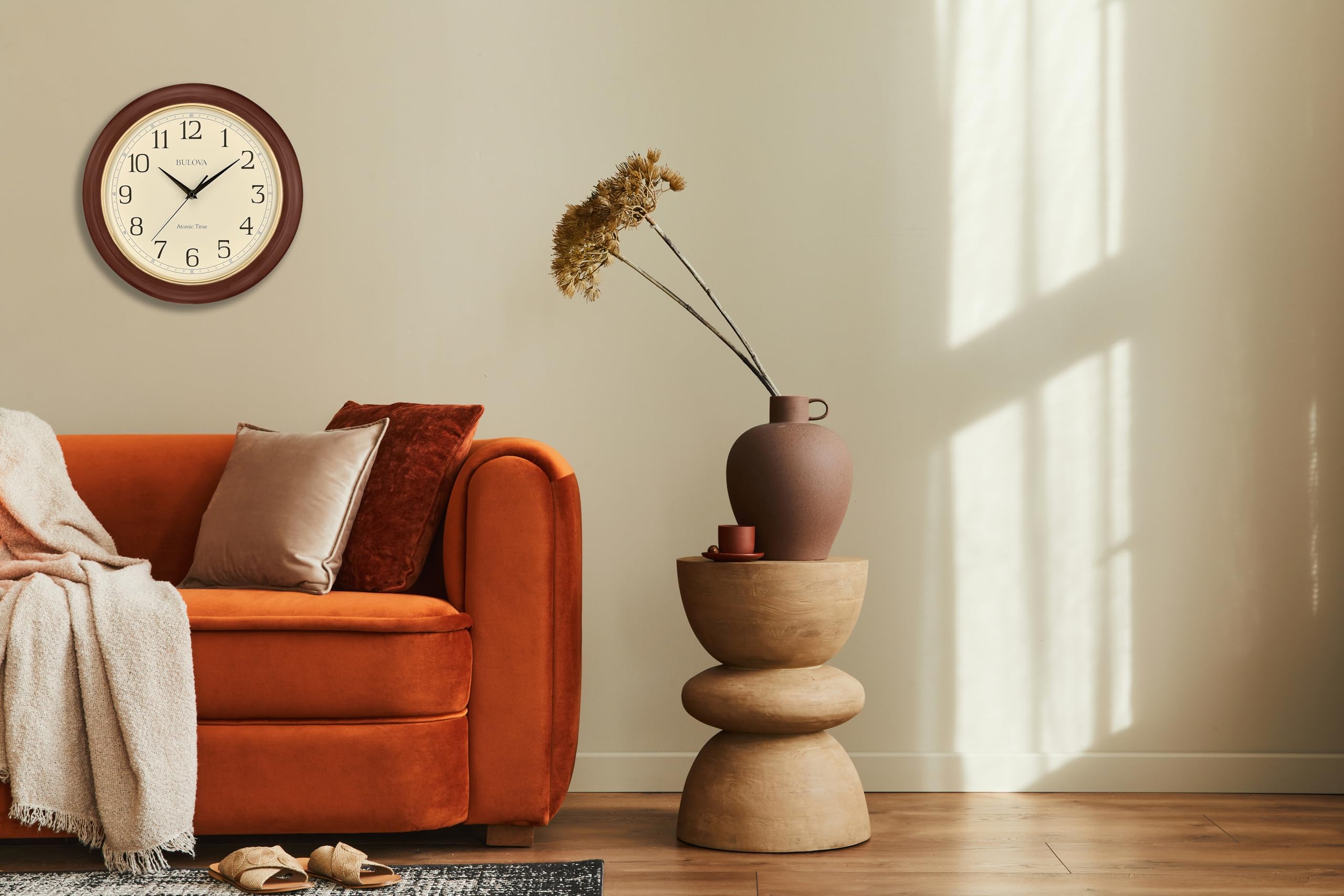 Bulova size scale on wall showing 12.4-inch fit for medium rooms benefit