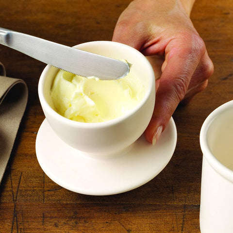 Butter Bell ivory matte beside a butter stick showing compact size and capacity