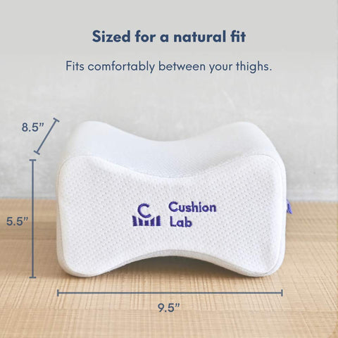 C CUSHION LAB held in hand for size comparison showing compact, travel-friendly wedge support