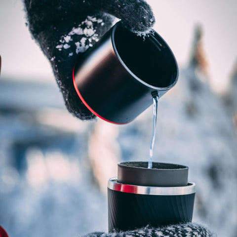 Cafflano Klassic brewing outdoors at a campsite showing travel convenience and simplicity