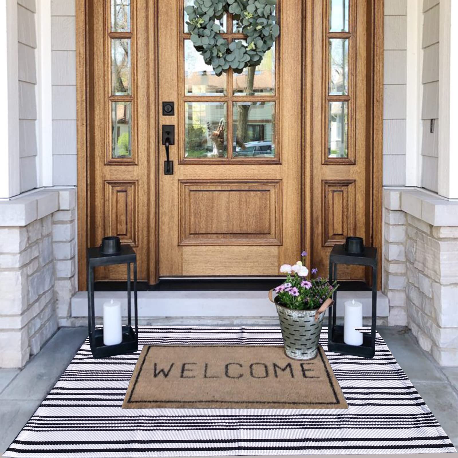 CAINANEL layered with hello mat creates welcoming layered look