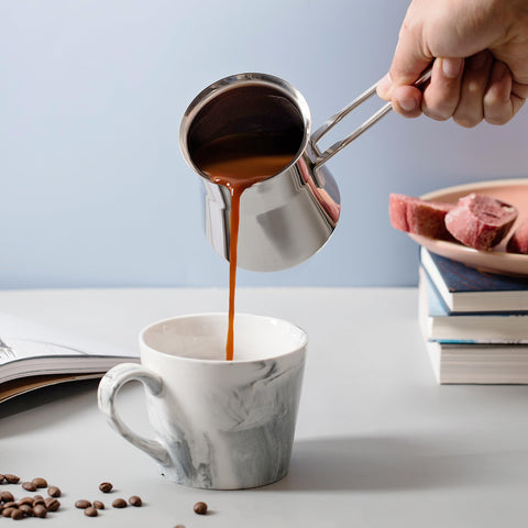 Caizen Coffee briki heating on gas stovetop for even brewing