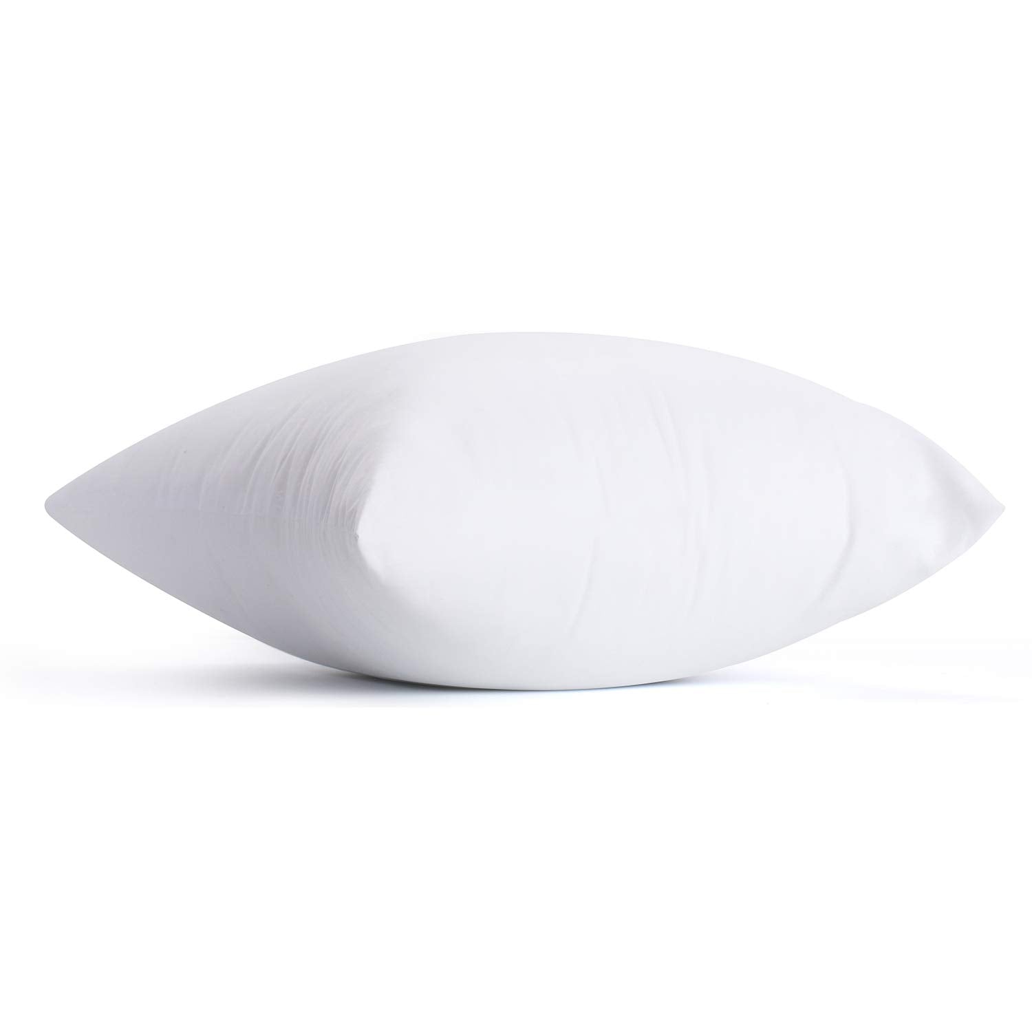 Calibrate Timing pillows styled on bedroom bed, cohesive decor and supportive comfort