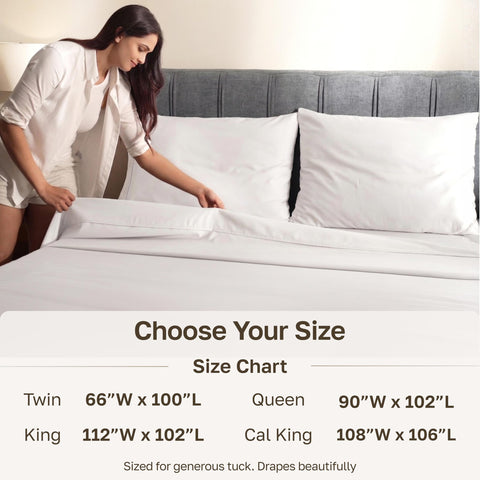 California Design Den flat sheet draped on king bed demonstrating full coverage and tuckability