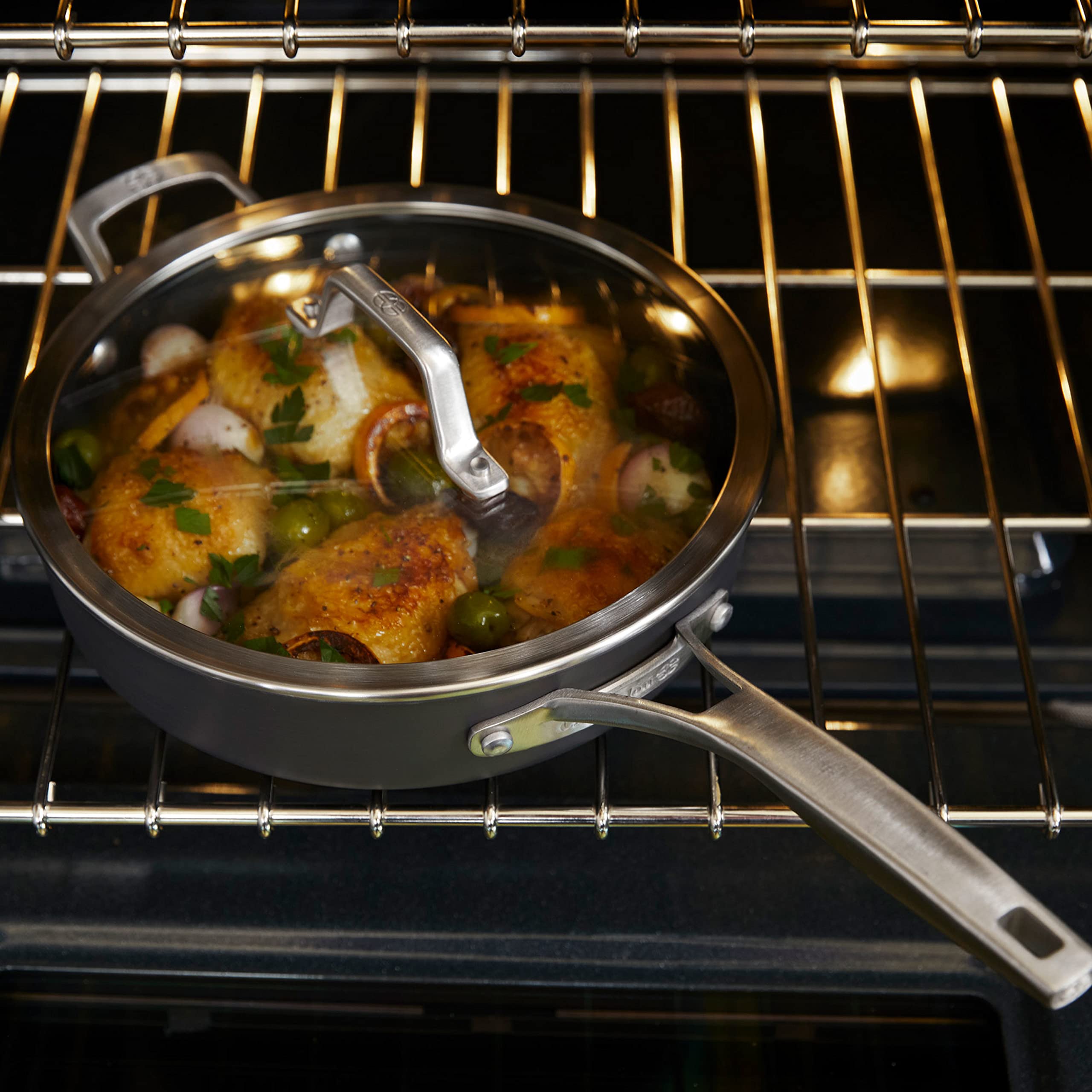 Calphalon Premier on stove with food being sautéed to illustrate everyday cooking performance