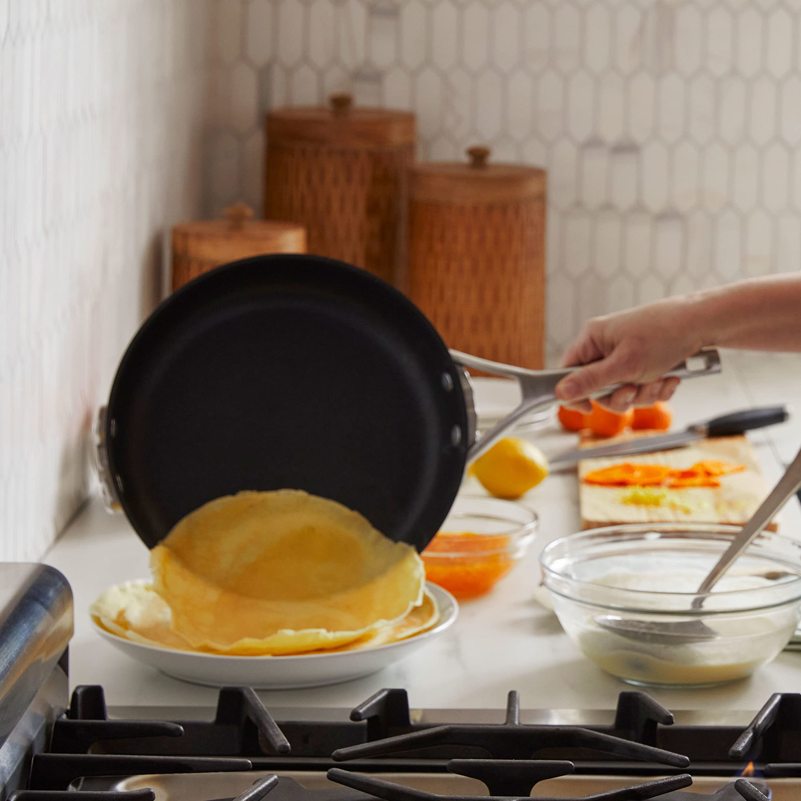 Calphalon pot next to kitchen tools showing 12‑quart size reference