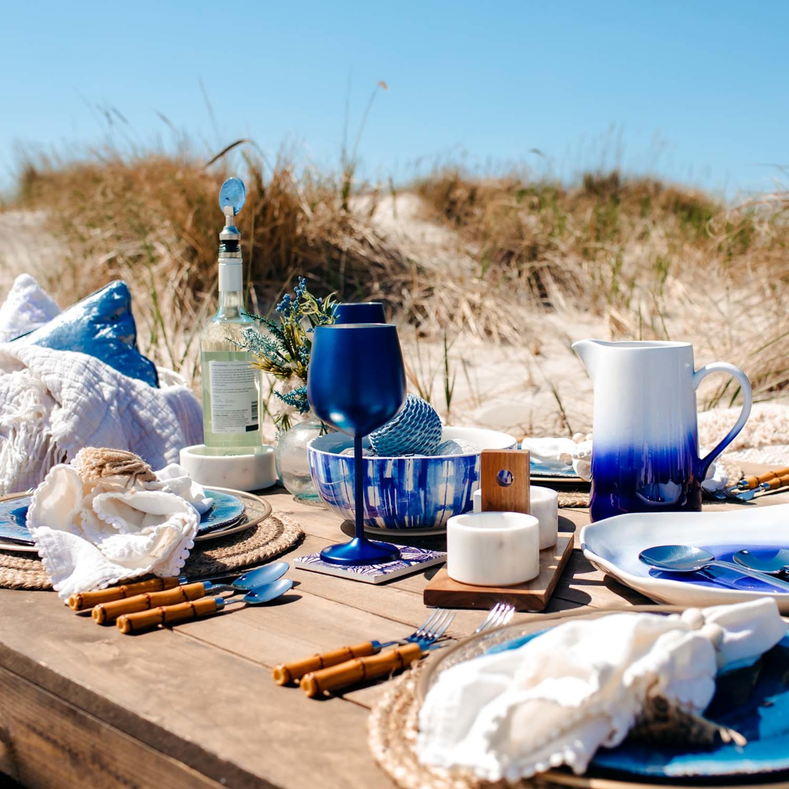 CAMBRIDGE flatware on rattan charger styled table showing decor pairing benefit