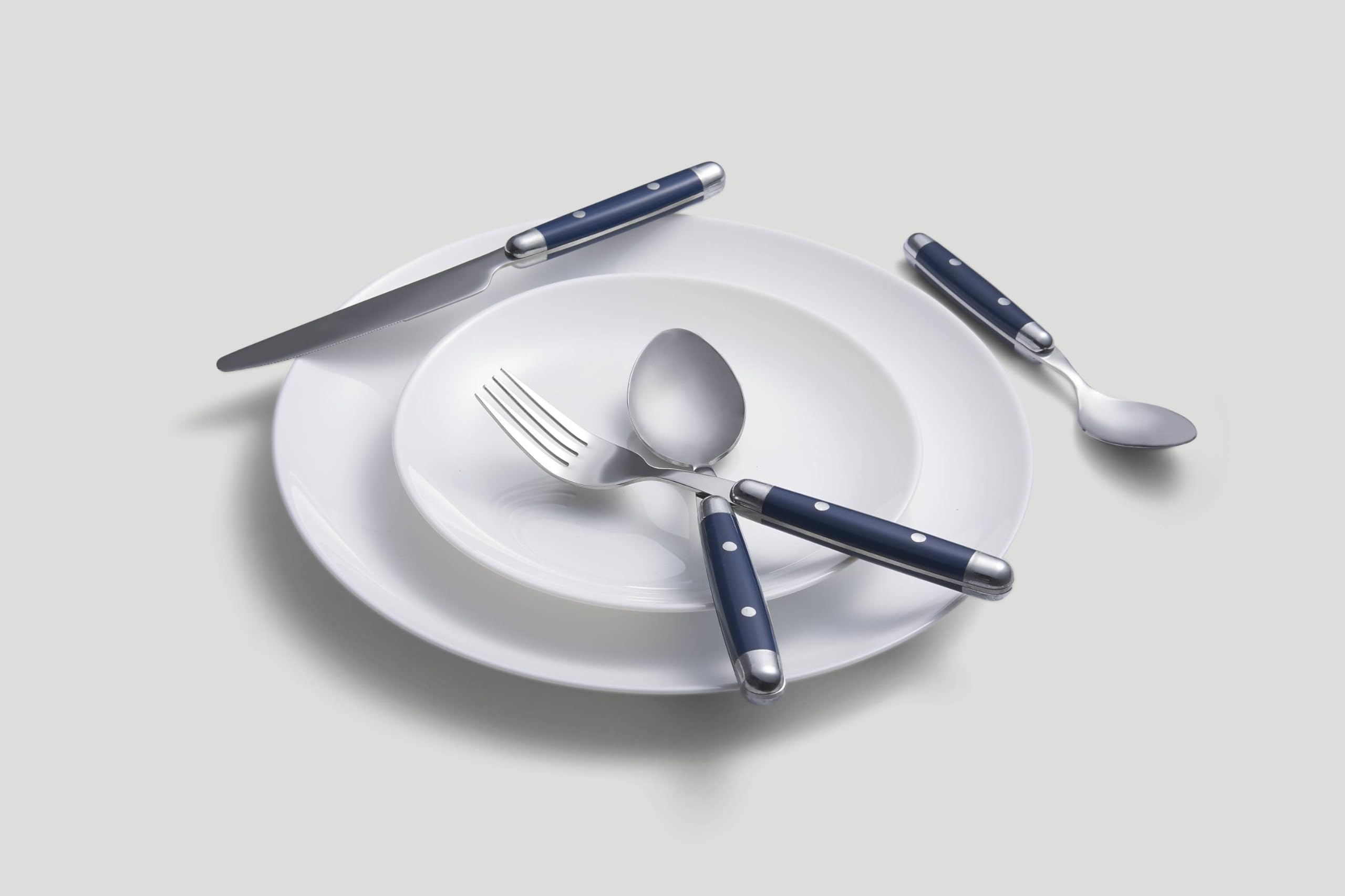 Cambridge Jubilee Blue flatware arranged on a dining table, elevates casual meals