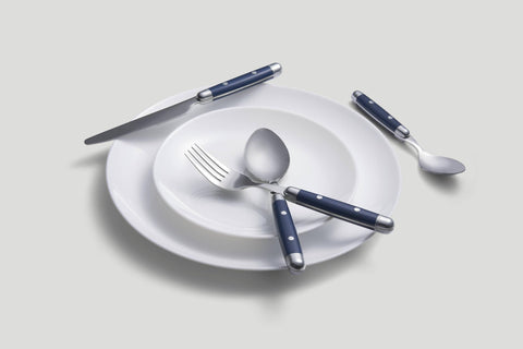 Cambridge Jubilee Blue flatware arranged on a dining table, elevates casual meals
