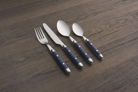 Cambridge Jubilee Blue next to a plate for scale, shows practical utensil size