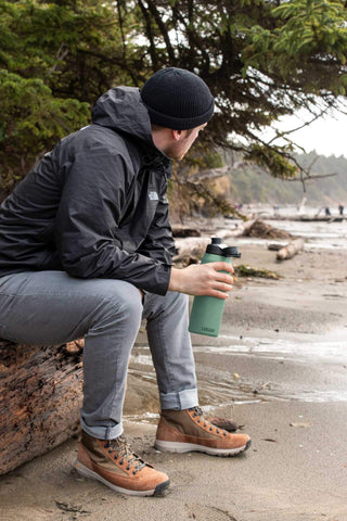 CamelBak in outdoor setting showing rugged moss bottle suited for adventures