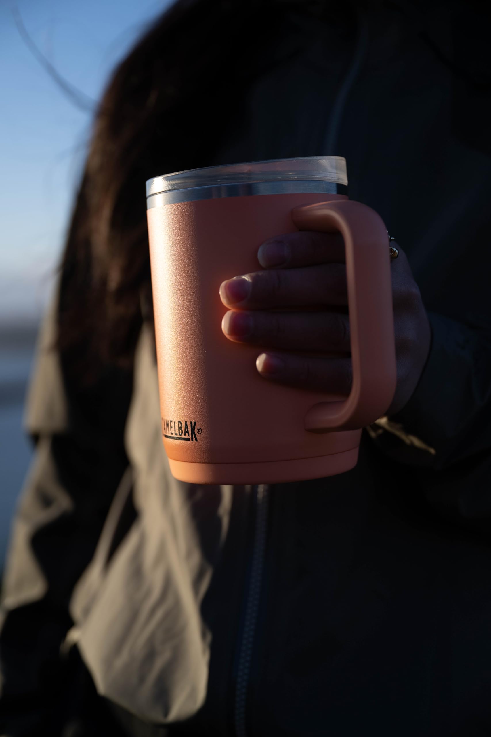 CamelBak Thrive on desk with coffee demonstrating commuter-ready convenience benefit