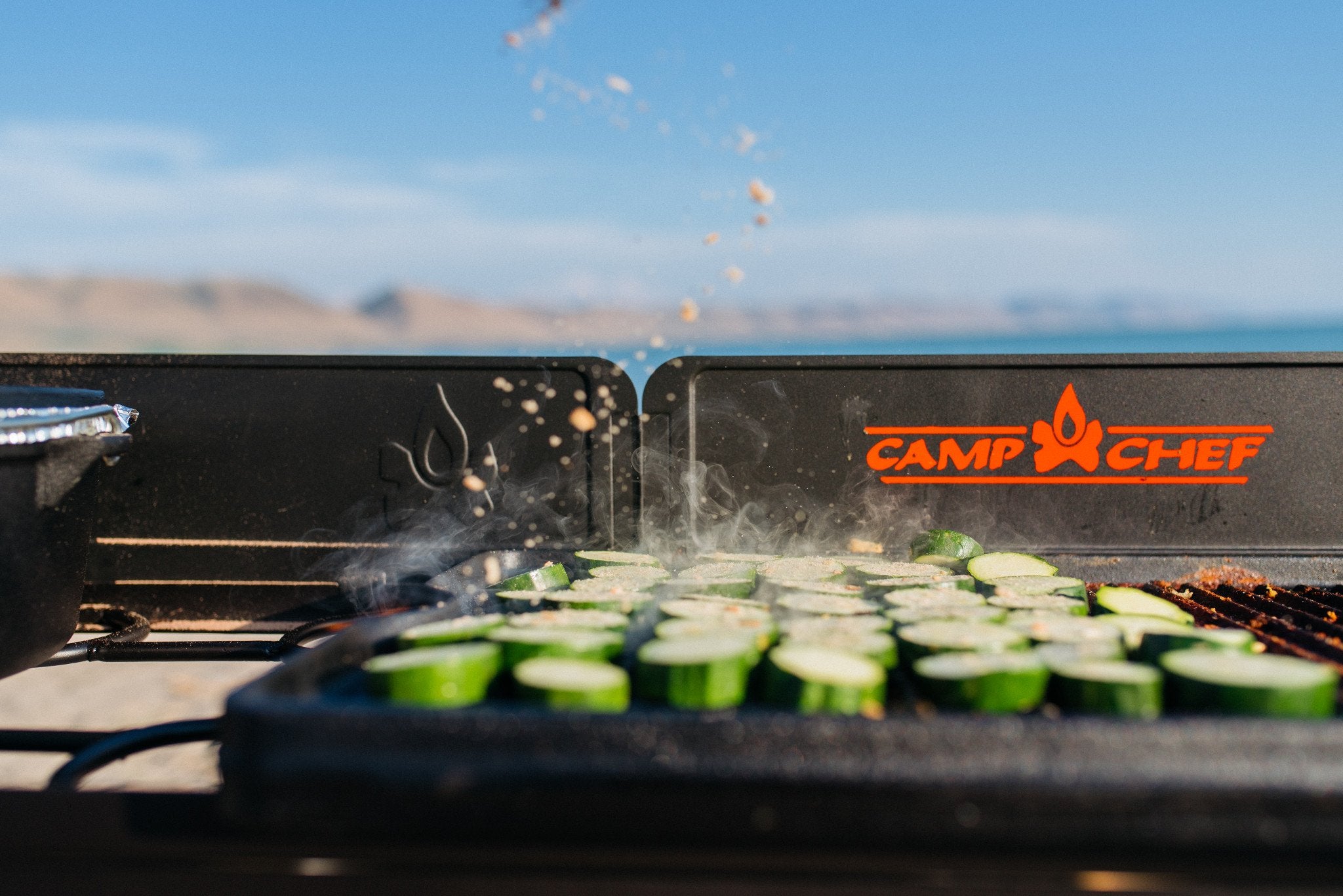 Camp Chef griddle beside utensils to show size comparison and crowd-ready capacity