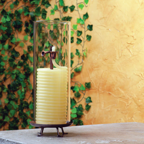 Candle by the Hour copper-tone wick clip detail, demonstrates safety self-extinguishing feature