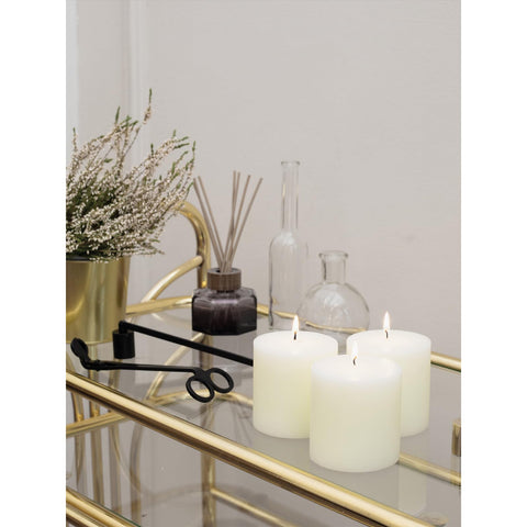 CANDWAX three pillars styled on a dining centerpiece creating warm, neutral decor benefit