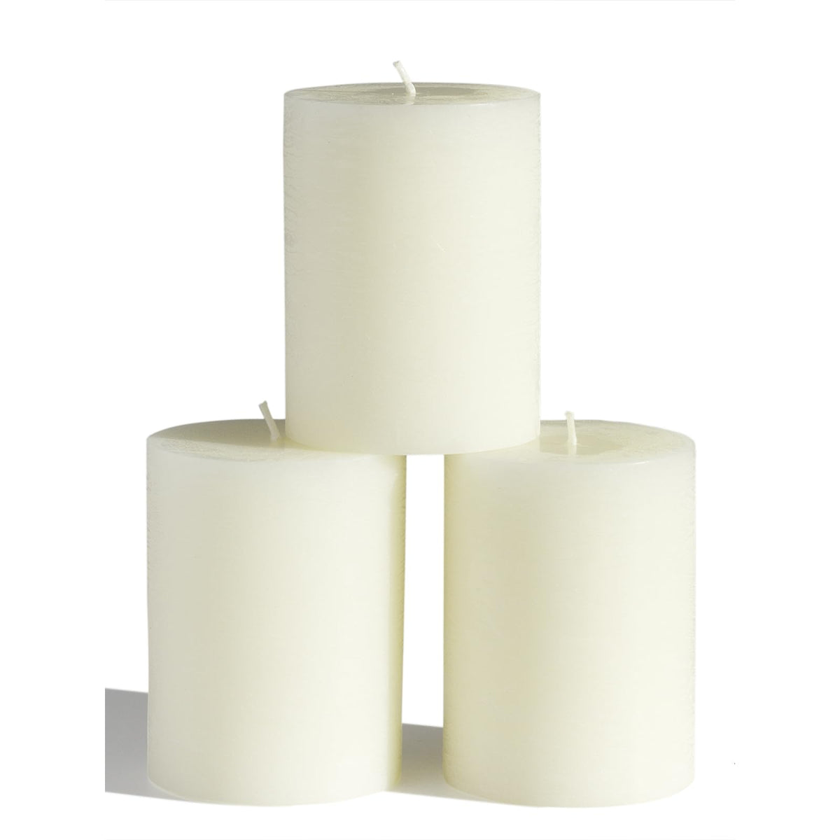 CANDWAX front view of three ivory 3x4 pillar candles for elegant decor