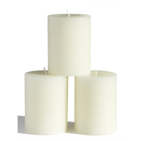 CANDWAX front view of three ivory 3x4 pillar candles for elegant decor