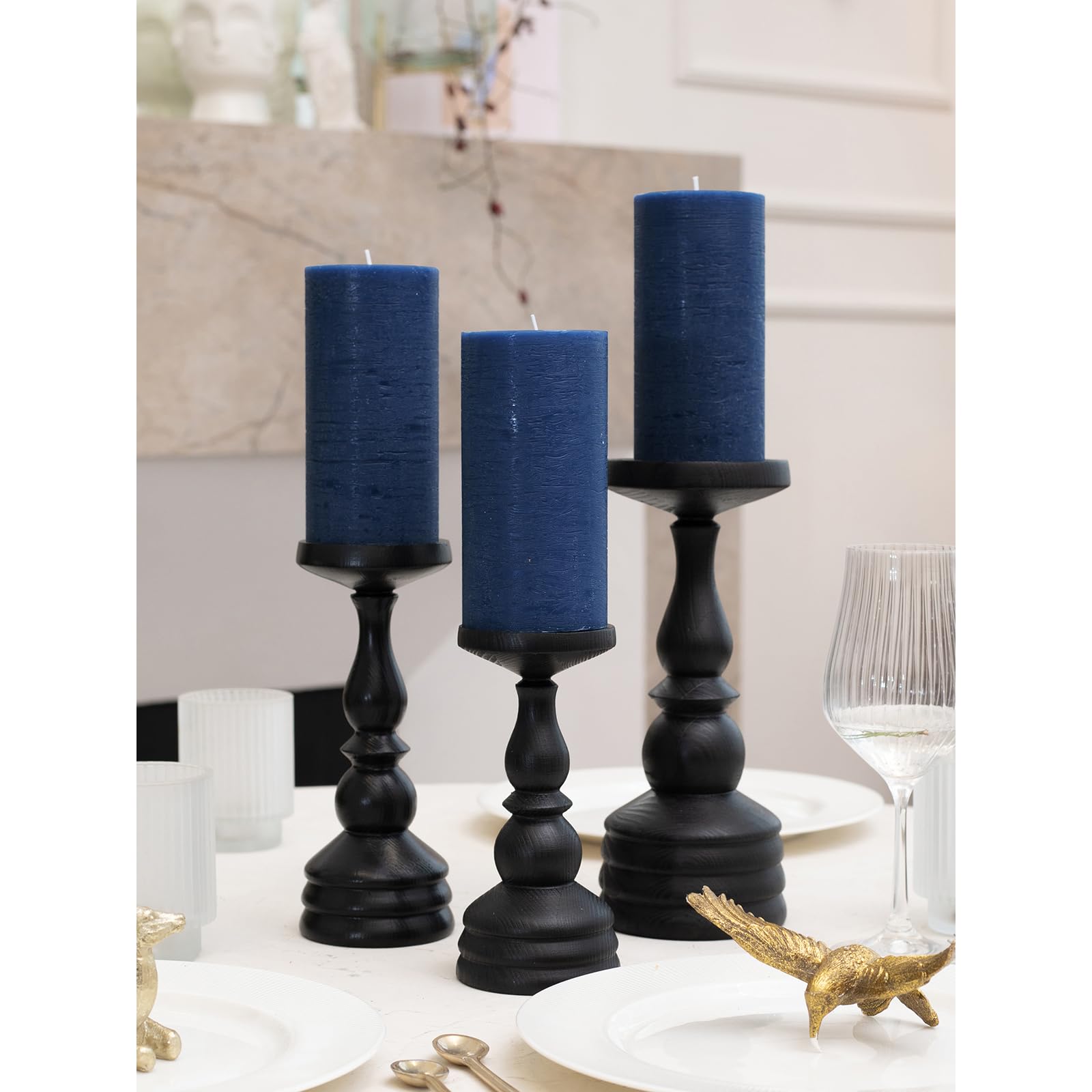 CANDWAX lit pillar trio on table centerpiece providing warm, unscented ambient light
