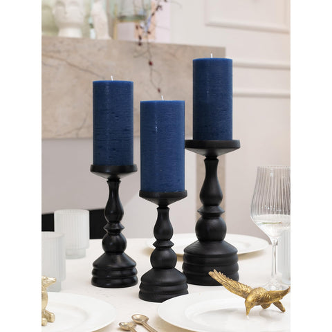 CANDWAX lit pillar trio on table centerpiece providing warm, unscented ambient light