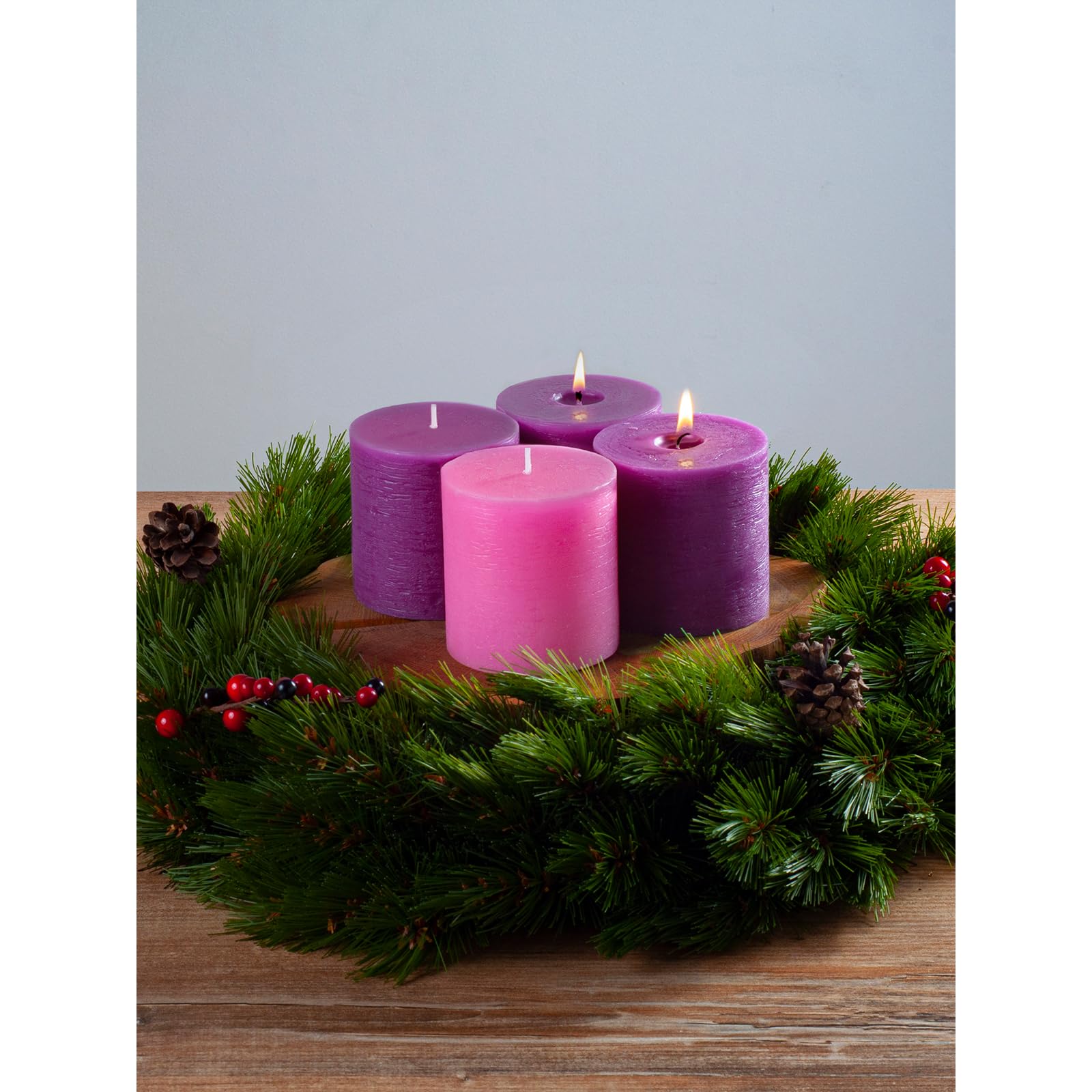 CANDWAX pillars styled on a mantel adding cozy holiday ambiance and simple elegance