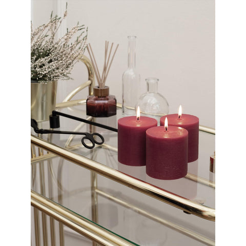 CANDWAX pillars on a living room mantel illustrating home styling benefit: rustic charm