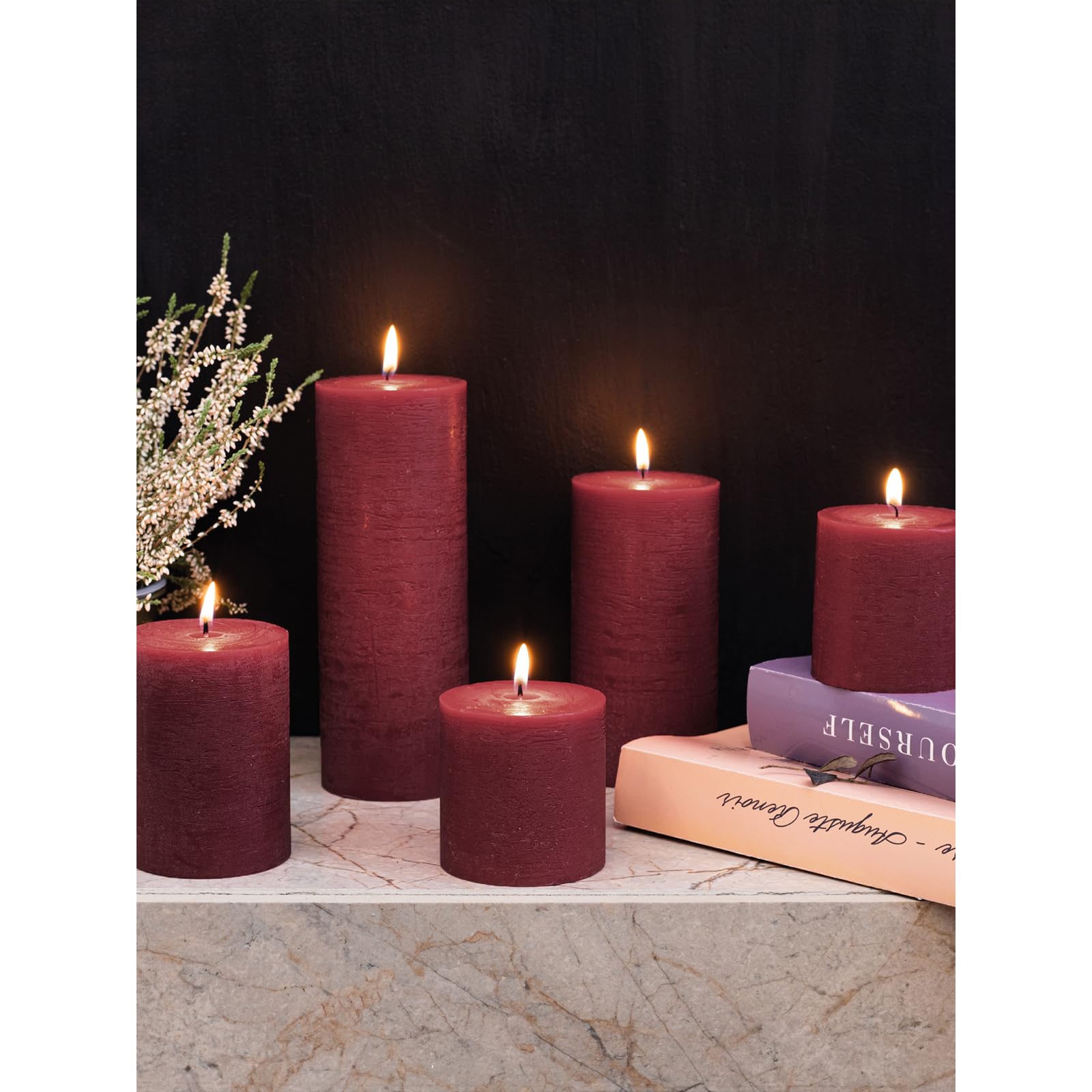 CANDWAX candle held next to a hand showing scale benefit: clear size reference