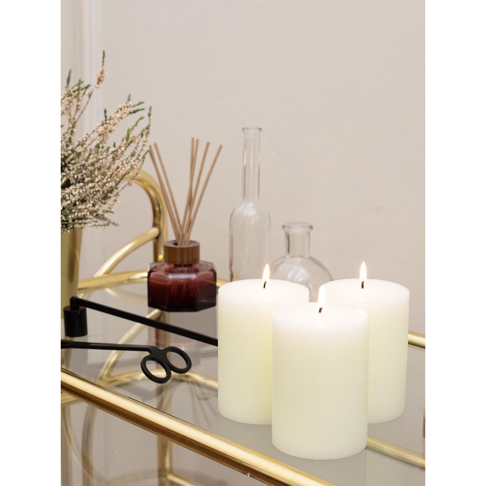 CANDWAX 3x4 pillar candles beside a ruler showing accurate size and scale