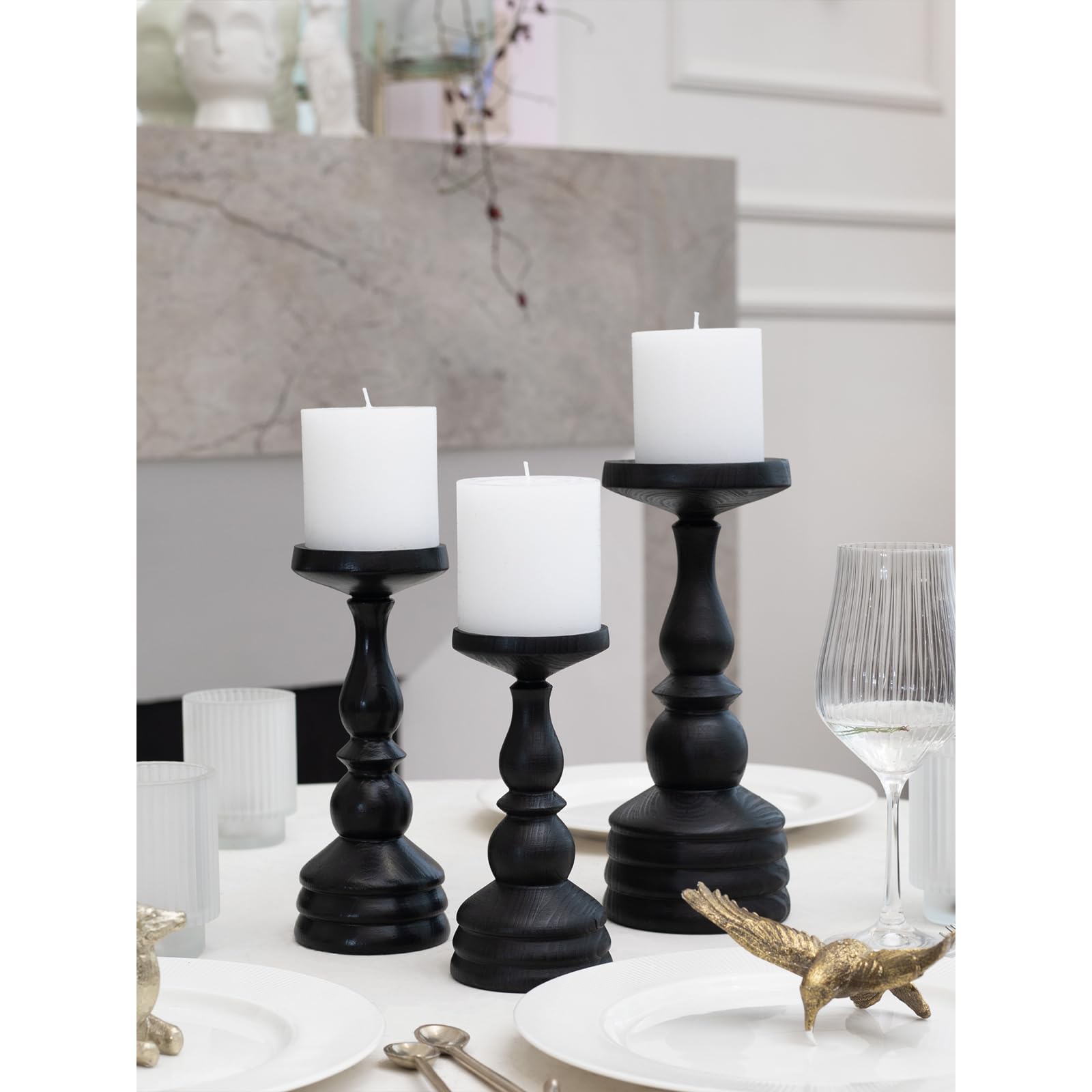 CANDWAX trio set on wooden table offering warm ambient light for dining