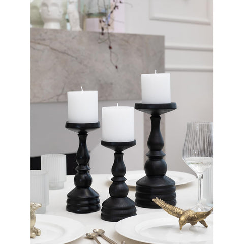 CANDWAX trio set on wooden table offering warm ambient light for dining