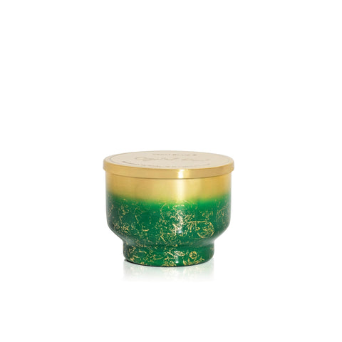 Capri Blue jar reused as votive holder illustrating sustainable decorative use
