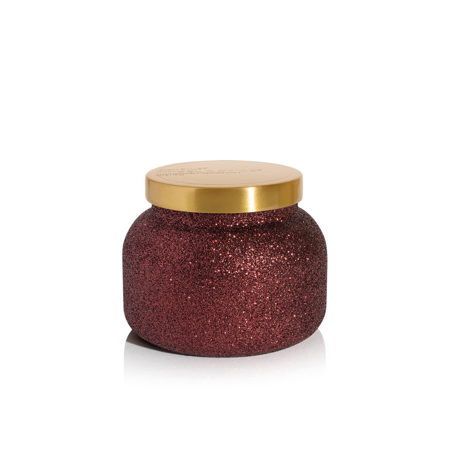 Capri Blue front jar view showing maroon glitter and festive appeal